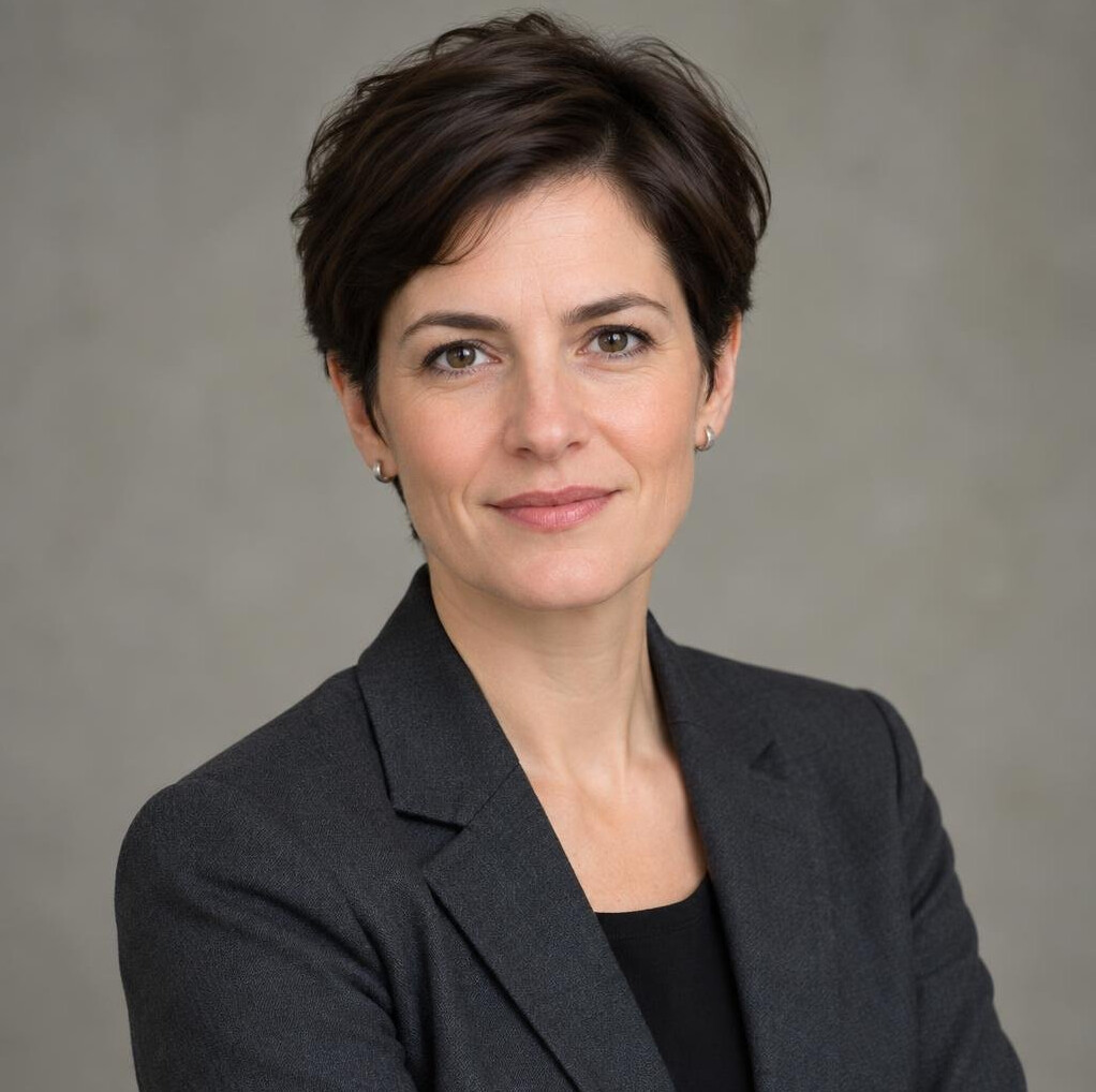 Studio portrait of a german woman researcher with short dark hair