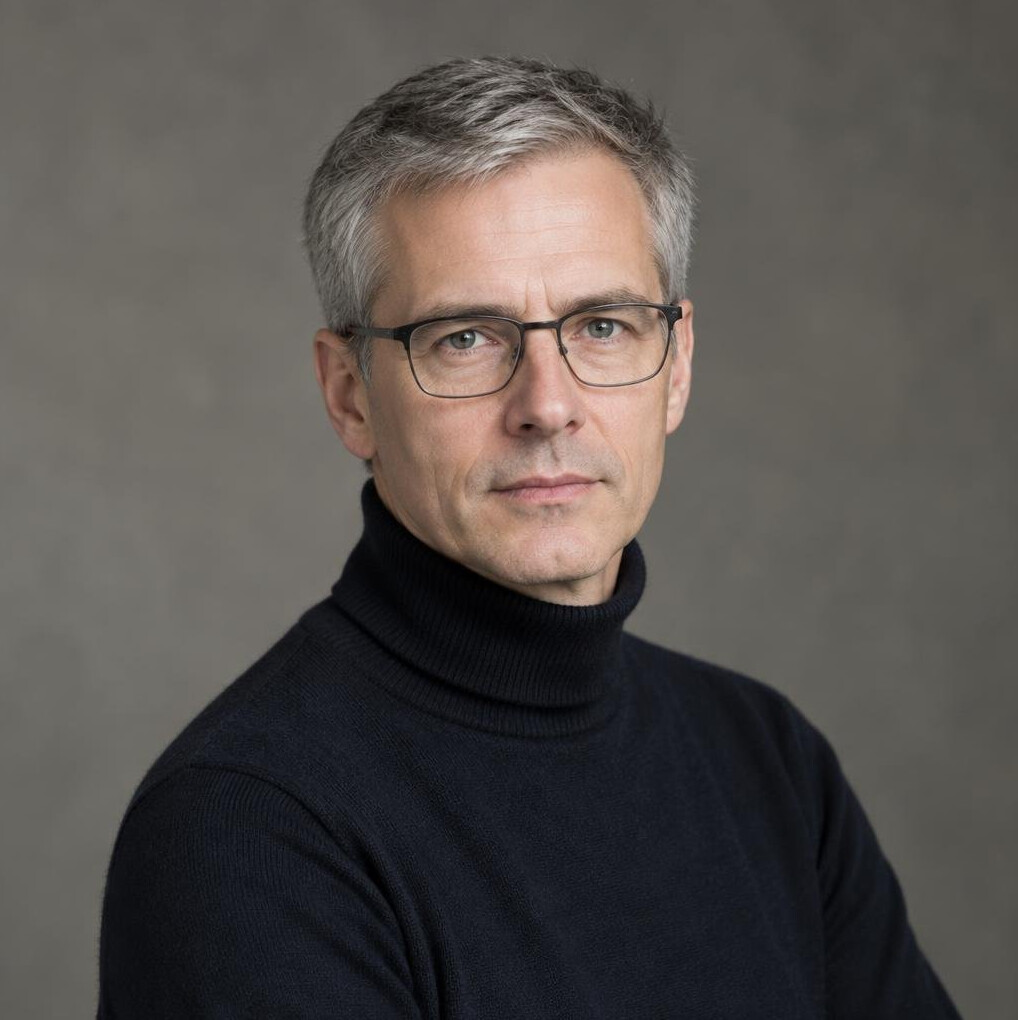 Studio portrait of a serious middle-aged german man with glasses, academic researcher