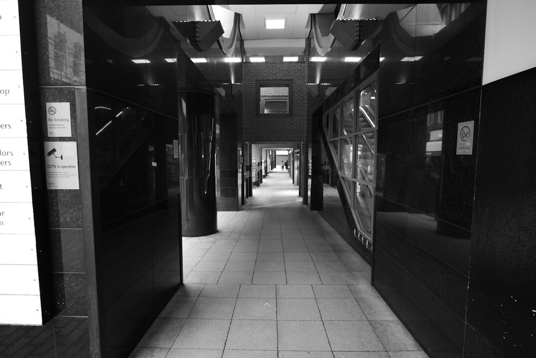Archive corridor with tall shelves of bound documents